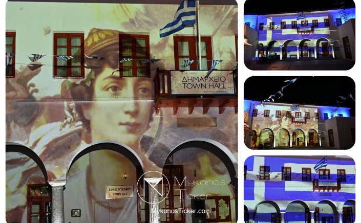 Independence Day in Mykonos: Με τα χρώματα της ελληνικής σημαίας και την ηρωϊκή μορφή της Μαντούς Μαυρογένους φωταγωγήθηκε το Δημαρχείο Μυκόνου